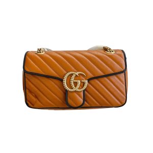 Gucci pumpkin colored black border bag